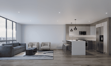Bayonne apartment for rent - A modern living room with a grey sofa, two chairs, a coffee table, and a kitchen area in the background.
