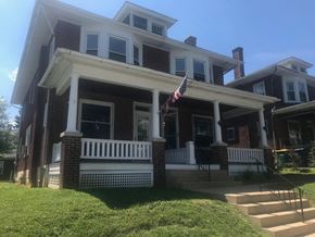 West Lawn house for rent - A house with a flag on the porch.