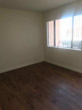 North Hills apartment for rent - A room with a window and wooden flooring.