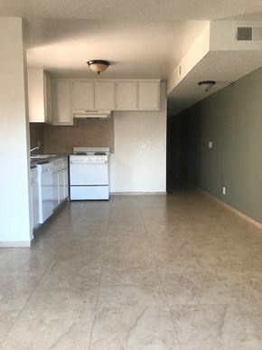 North Hills apartment for rent - A kitchen with white appliances and cabinets.