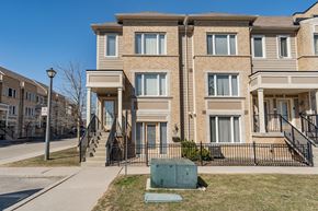 Mississauga apartment for rent - A row of townhouses with a clear blue sky above.