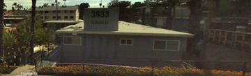 San Diego apartment for rent - A grey building with the number 3933 on it.