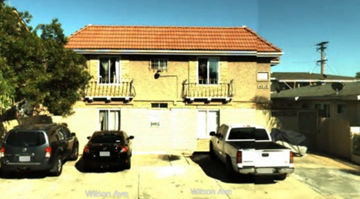 San Diego apartment for rent - A house with a red roof and a car parked in front.