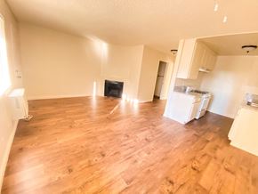 North Hills apartment for rent - A living room with a fireplace and hardwood floors.
