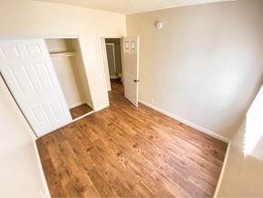 North Hills apartment for rent - A room with wooden flooring and white walls.
