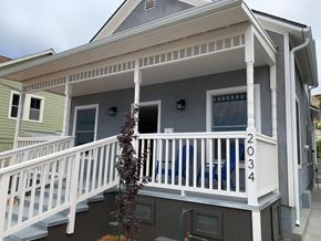 San Luis Obispo house for rent - A house with a porch and a plant in front.