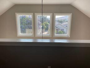 San Luis Obispo house for rent - A room with a window overlooking a residential area.