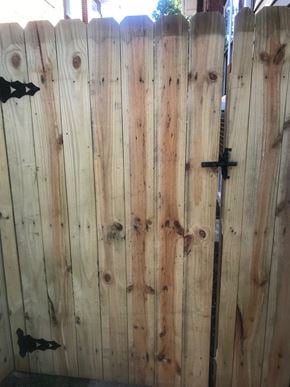 West Lawn house for rent - A wooden fence with a black latch.