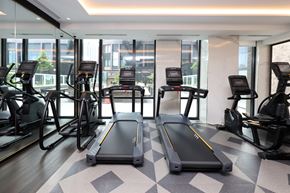 Toronto apartment for rent - A gym with treadmills and elliptical machines.