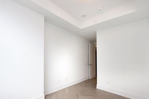 Toronto apartment for rent - A white room with a door on the right side.
