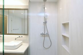 Toronto apartment for rent - A white sink is on a counter under a mirror in a bathroom.
