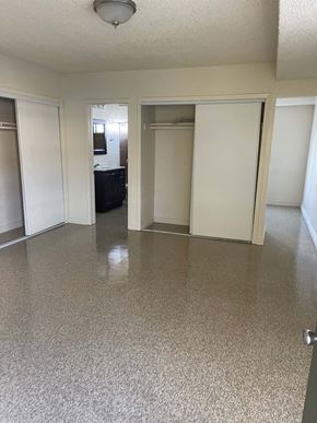Van Nuys apartment for rent - A room with a white floor and walls, and a ceiling light.