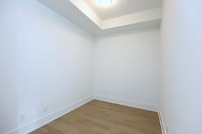Toronto apartment for rent - A room with white walls and wooden flooring.