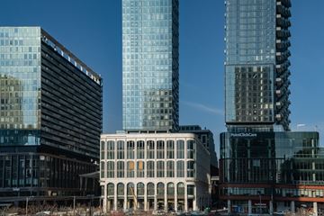Toronto apartment for rent - A cityscape with modern buildings and a clear blue sky.