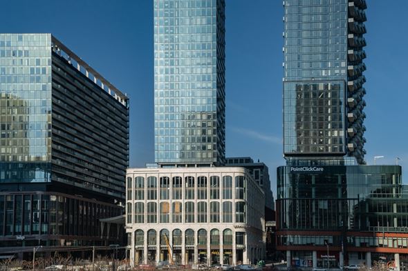 Toronto apartment for rent - A cityscape with modern buildings and a clear blue sky.