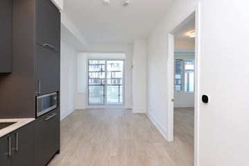 Toronto apartment for rent - A kitchen with a microwave and a fridge.