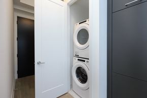 Toronto apartment for rent - A white door is open to reveal a white washing machine.