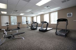 Mississauga apartment for rent - A gym with treadmills, elliptical machines, and other cardio equipment.