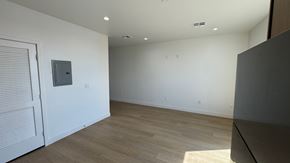 Inglewood apartment for rent - A room with a white door and a grey box on the wall.