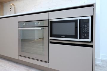Toronto apartment for rent - A modern kitchen with a built-in oven and microwave.