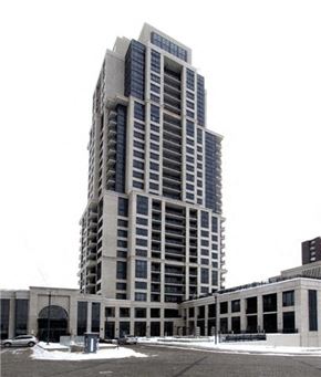 Etobicoke apartment for rent - A tall building with many windows is in the background.
