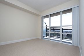 Etobicoke apartment for rent - A room with a sliding glass door leading to a balcony.