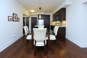 Toronto apartment for rent - A dining room with a table and chairs.