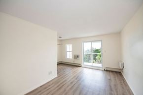 Prince Albert apartment for rent - A room with a sliding glass door leading to a balcony.