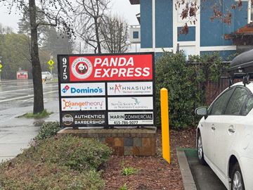 Novato apartment for rent - A sign for Panda Express is displayed in front of a building.