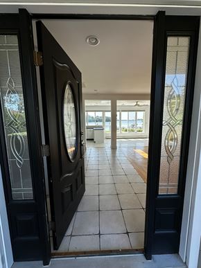 Annapolis house for rent - A black door with a glass window is open.