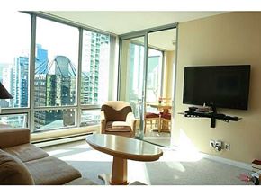 Vancouver apartment for rent - A living room with a flat screen TV mounted on the wall.
