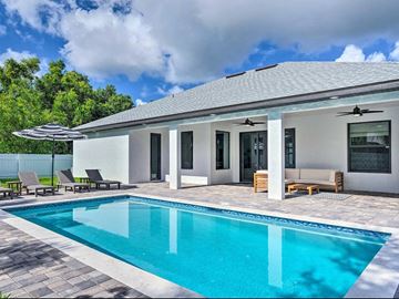 Cape Coral house for rent - A modern house with a pool in the backyard.