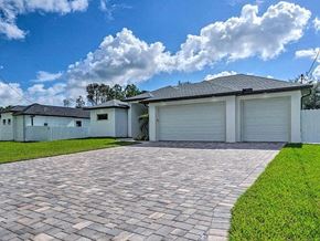 Cape Coral house for rent - A house with a driveway in front of it.
