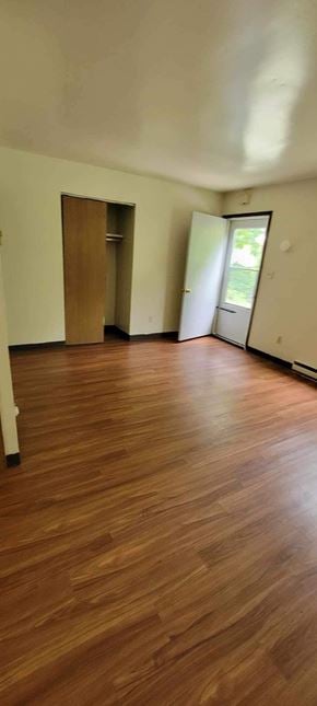 Rayland apartment for rent - A room with a wooden floor and a door.