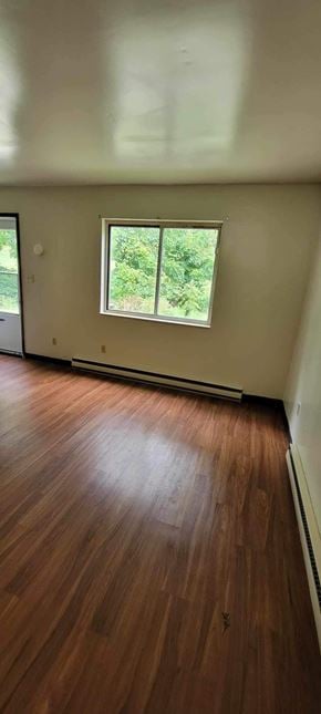 Rayland apartment for rent - A room with a window and wooden flooring.