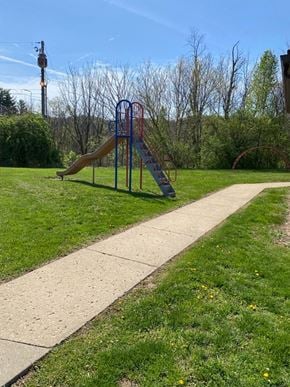 Bridgeport apartment for rent - A playground with a slide and a walkway.