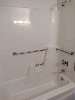 Grantsville apartment for rent - A white bathtub with a shower head and faucet.