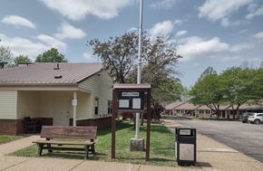 Grantsville apartment for rent - A sign that says "Welcome" stands in front of a building.