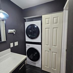 Fort Lauderdale apartment for rent - A white dryer and washer in a laundry room.