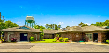 Myrtle Beach apartment for rent - A building with a water tower in the background.