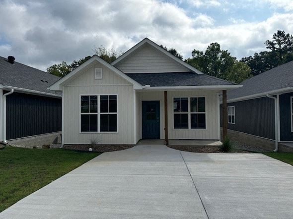 Little Rock house for rent - A house with a grey roof and a white door.