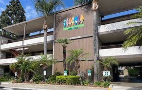 Anaheim apartment for rent - A building with a sign that says Palm Terrace.