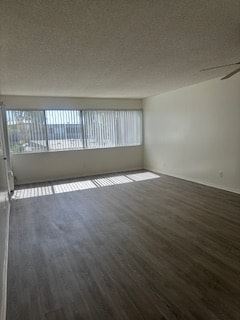 Anaheim apartment for rent - A room with a window and a wooden floor.