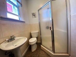 San Francisco house for rent - A bathroom with a toilet, sink, and shower.