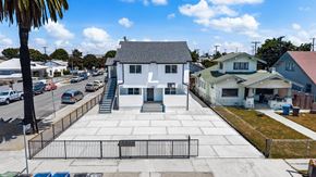 Los Angeles apartment for rent - A white building with a black gate in front of it.