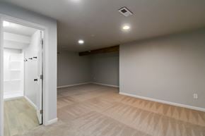 Evans house for rent - A room with a door on the left and a light on the ceiling.