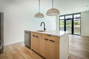 Columbus apartment for rent - A kitchen with wooden cabinets and a white countertop.