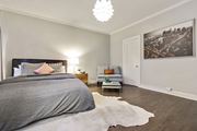 Los Angeles apartment for rent - A bedroom with a large bed and a cowhide rug.