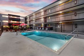 Los Angeles apartment for rent - A swimming pool in a courtyard surrounded by apartment buildings.