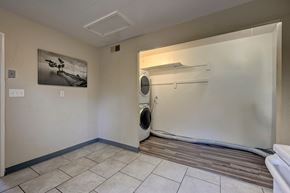Colorado Springs house for rent - A room with a washing machine and a painting on the wall.